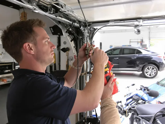 North Castle Garage Door Repair safety certified technician performing cable replacement in North Castle