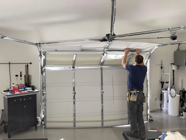 North Castle Garage Door Repair specialist performing precise section replacement on North Castle garage door